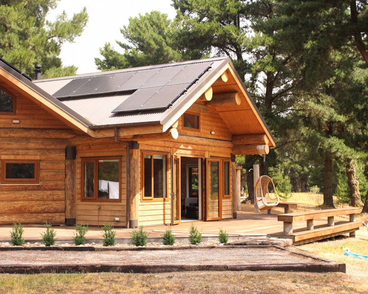 An exterior view of Stunning Private Log Cabin best winter cabins New Zealand