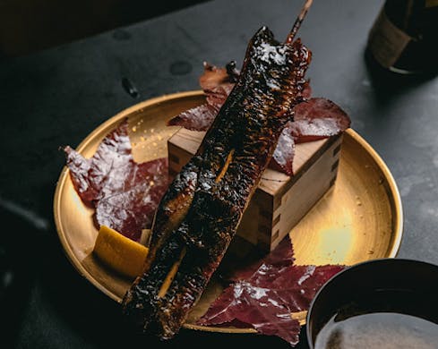 A long skewer of glistening unagi (eel). 
