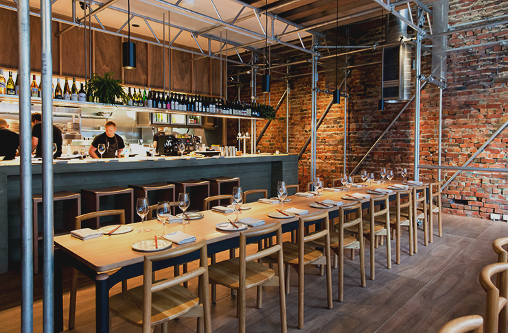 Steel beams and wooden furniture fill out one of the best restaurants in Melbourne for 2022.