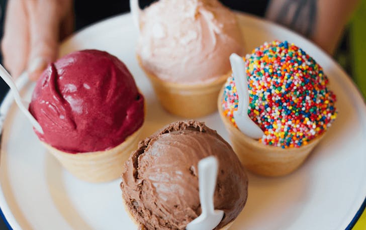Four scoops of one of the best ice cream in Melbourne including a raspberry and rainbow sprinkles.