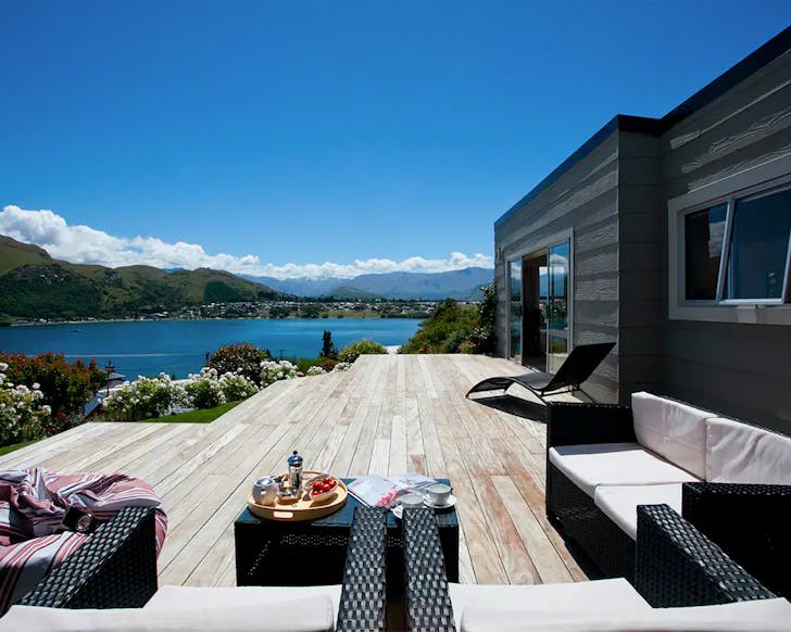 A large verandah overlooking the lake and mountains in Queenstown. One of the best airbnbs in NZ.