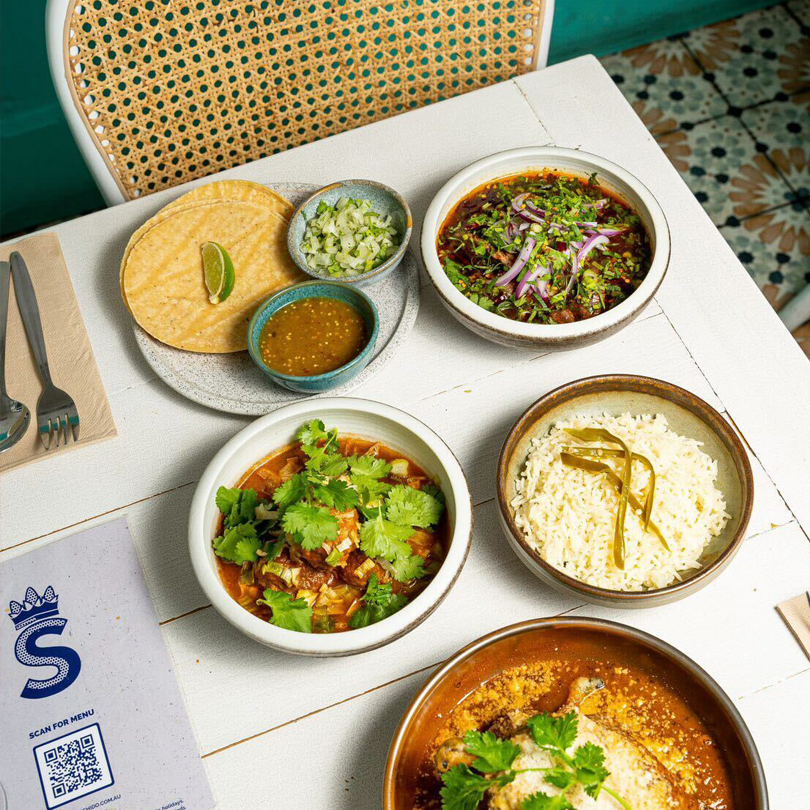 A table set with different dishes at one of the best Mexican restaurants in Melbourne.