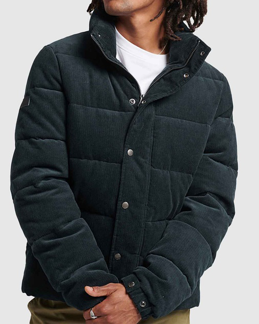 A green cord jacket, one of the best men's puffer jackets. 