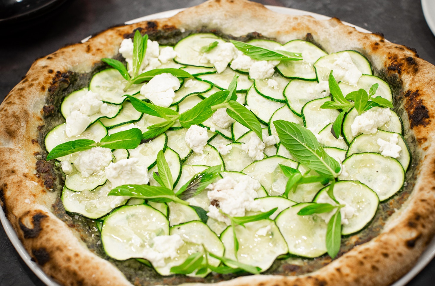 A pizza topped with courgette and feta from Ria Pizza 