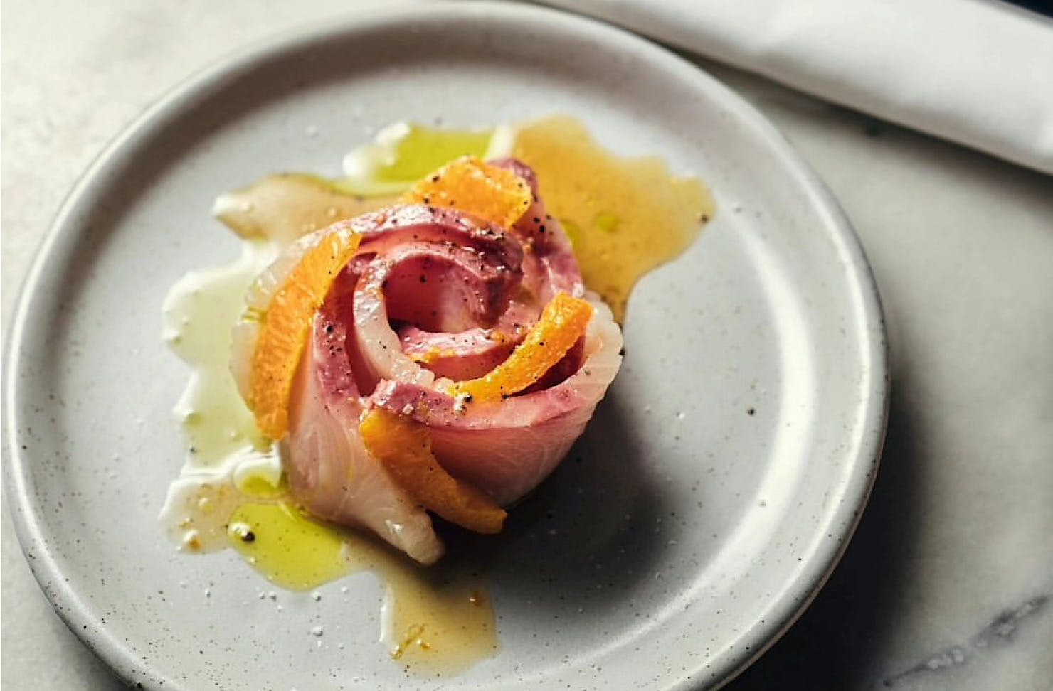 Raw fish and blood orange strips arranged in a rose shape from Supra, one of Wellington's best new restaurant openings. 