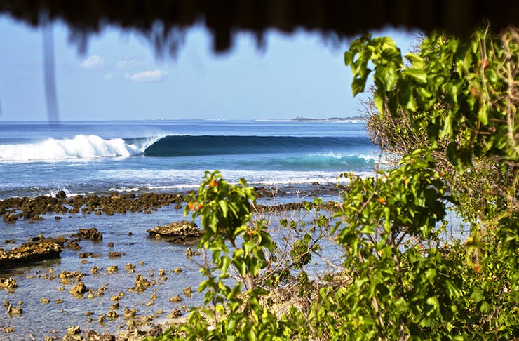 A photo from the resort of a wave peeling down down the reef. 