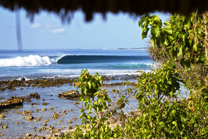 A photo from the resort of a wave peeling down down the reef. 