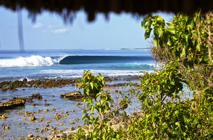 A photo from the resort of a wave peeling down down the reef. 