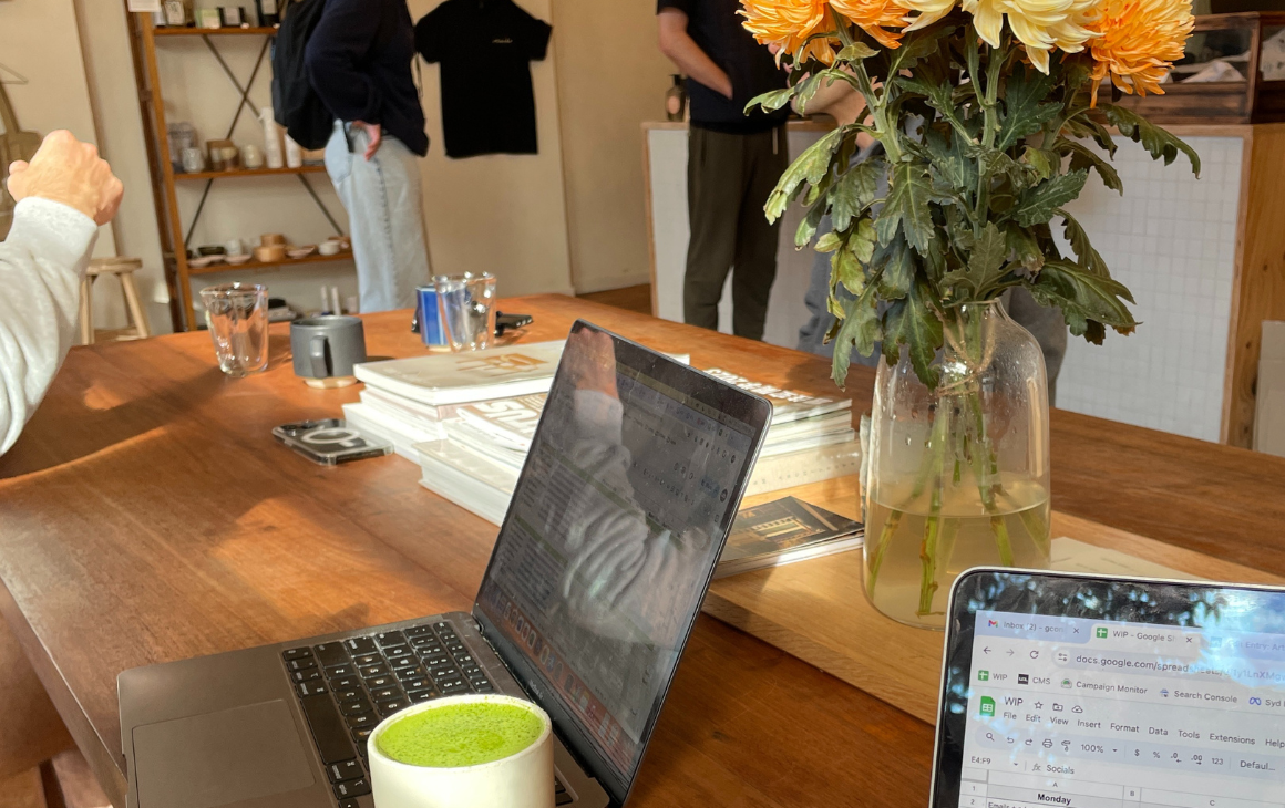 Two laptops on a communal table