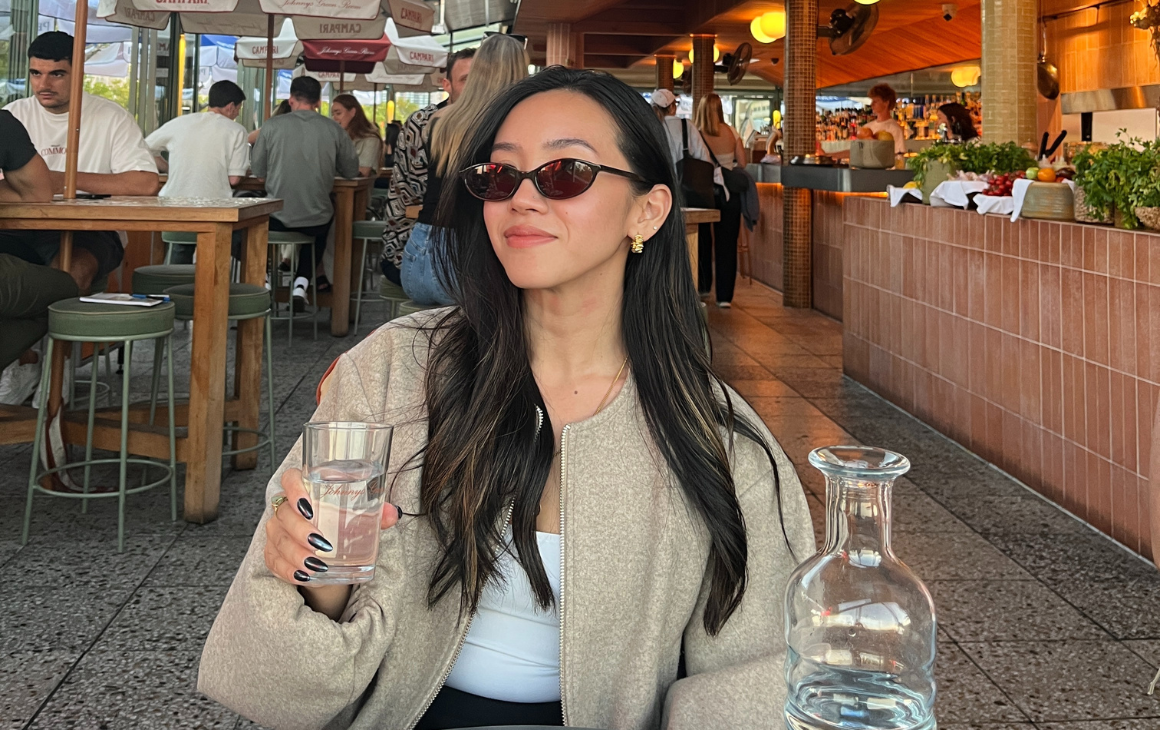 Woman sitting at rooftop bar