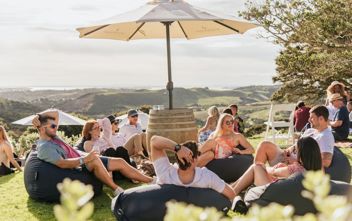 People sitting on beanbag lawns at an Auckland winery