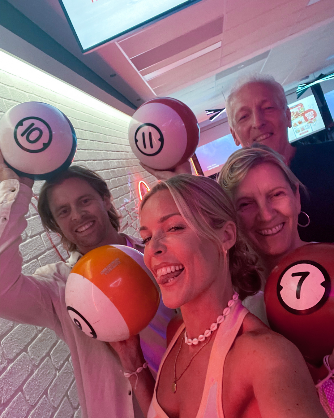 Group of friends ten pin bowling