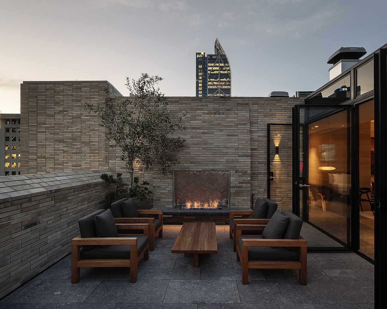 The Rangihoua room with a welcoming open fire next to a courtyard.