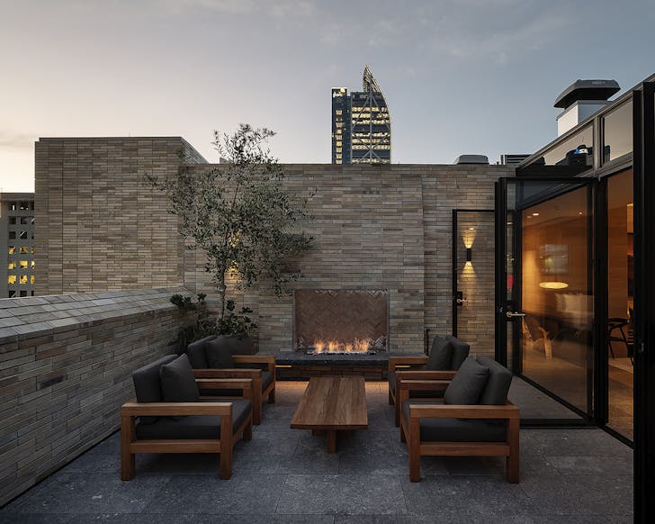 The Rangihoua room with a welcoming open fire next to a courtyard.