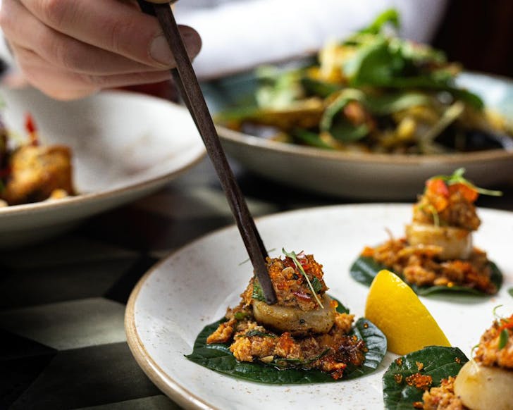 Seared scallops and tobiko on betel leaves at TOK TOK. 