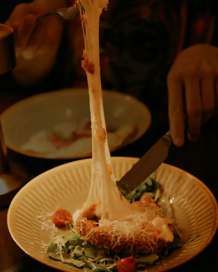 Cheese pull on a plate