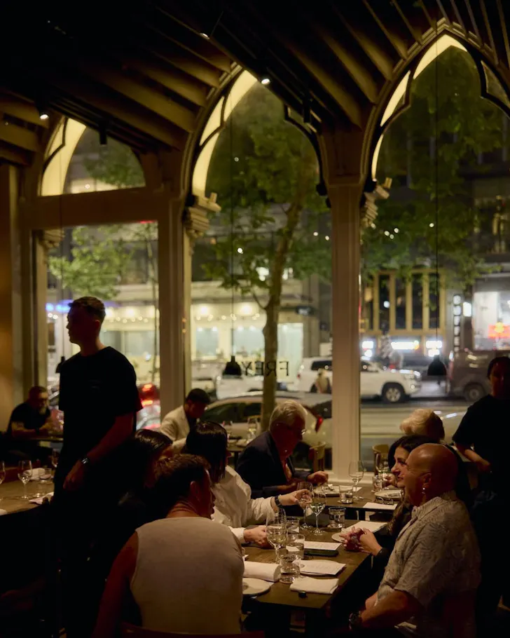 Dimly lit restaurant with arched windows