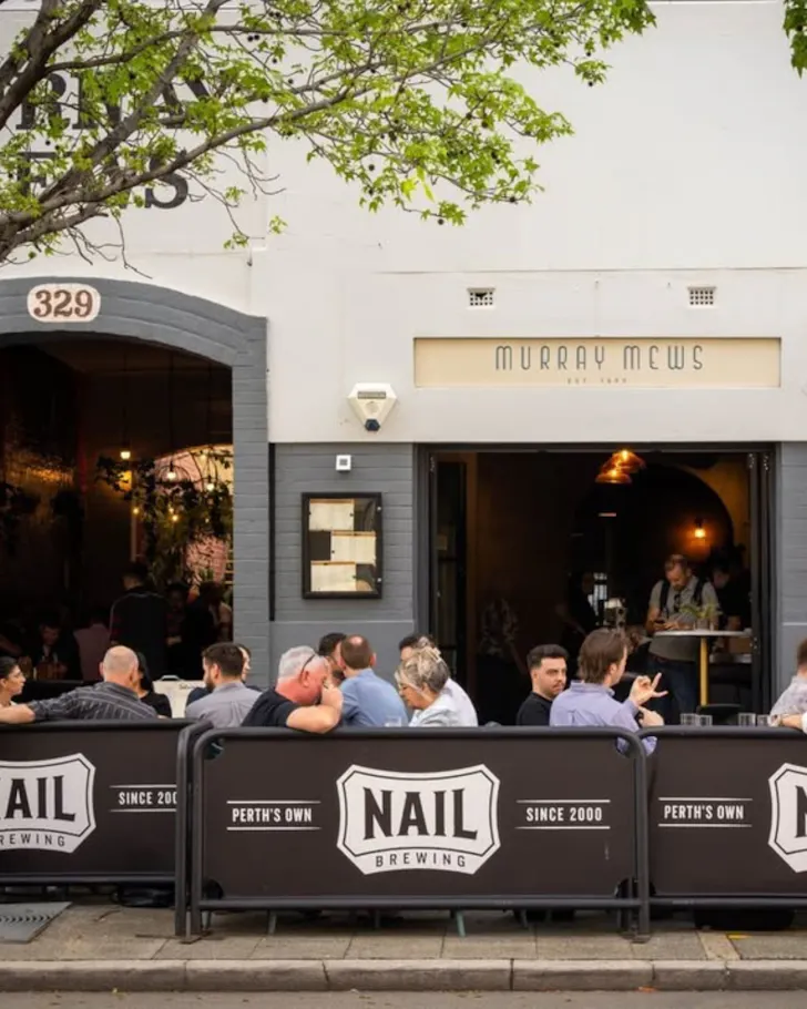 Exterior front of people on tables