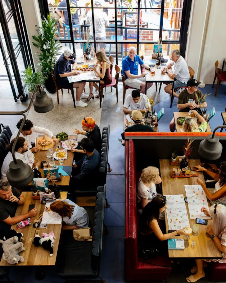 People below at tables on ground