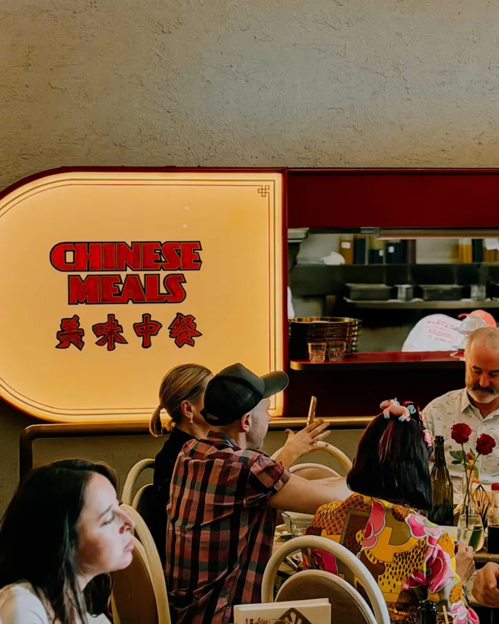 Yellow sign with word Chinese Dining on it