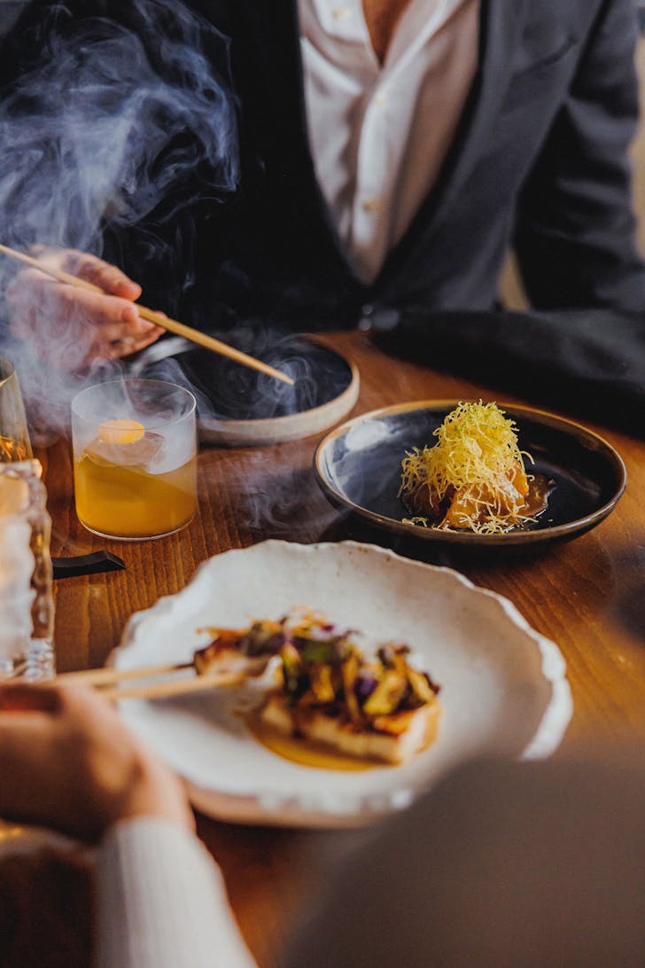 Food on table between two people.