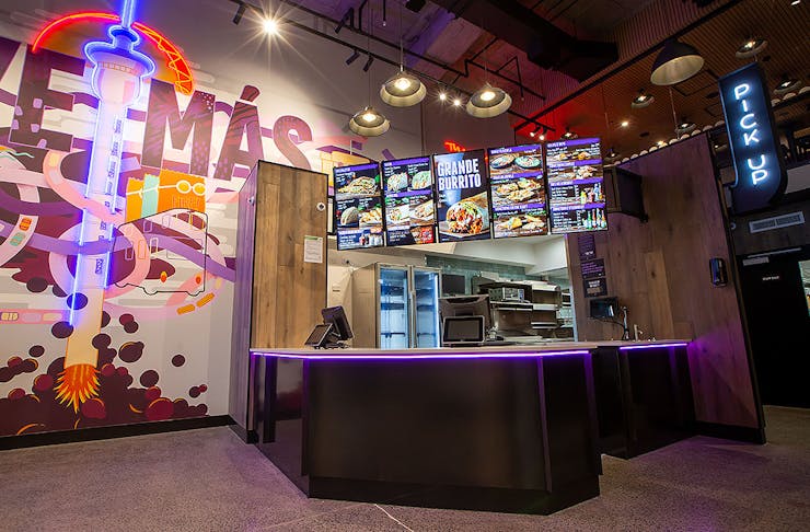 The interior of the new venue at Taco Bell Shortland Street showing a cool mural and counter.