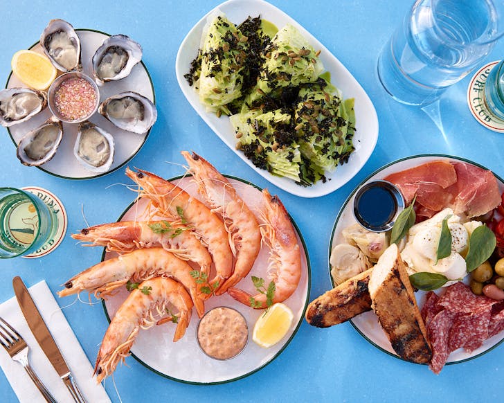 A sky blue table laden with seafood at Takapuna Surf Club. 