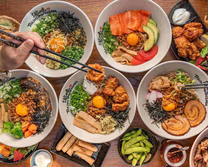 A smorgasbord of dishes from Takimi Mazesoba, one of the best Japanese restaurants in Auckland.