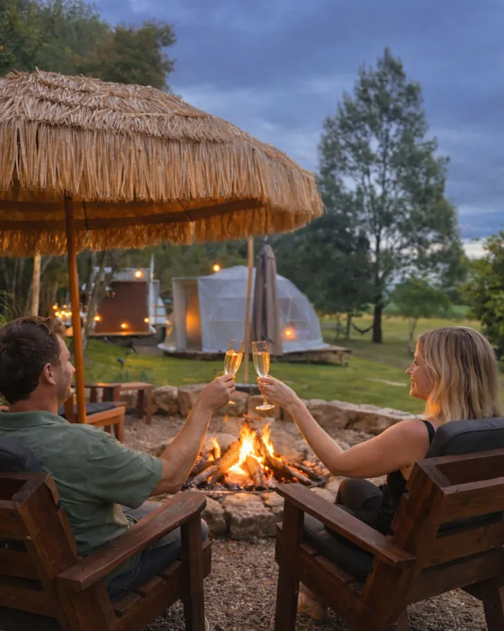 A couple around the campfire at Tallaringa Private Luxury Camping best glamping near Brisbane