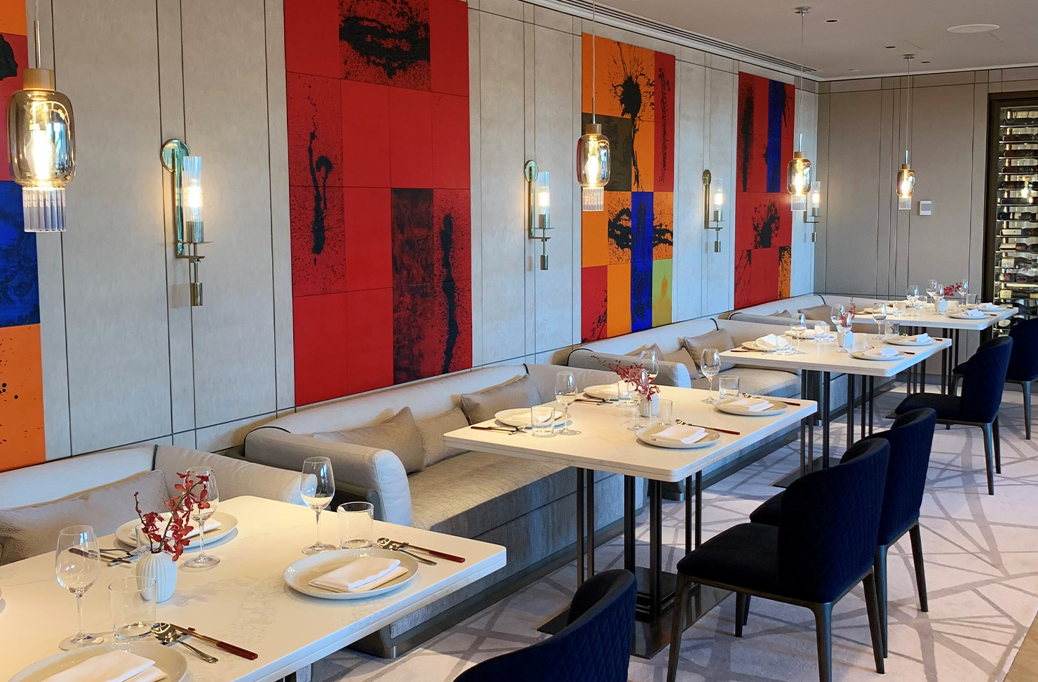 a Chinese restaurant with bold coloured paintings
