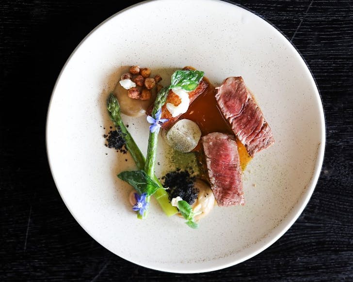 Beef fillet, chickpeas panisse, asparagus and kalamata olives at Tantalus, one of the best restaurants on Waiheke. 