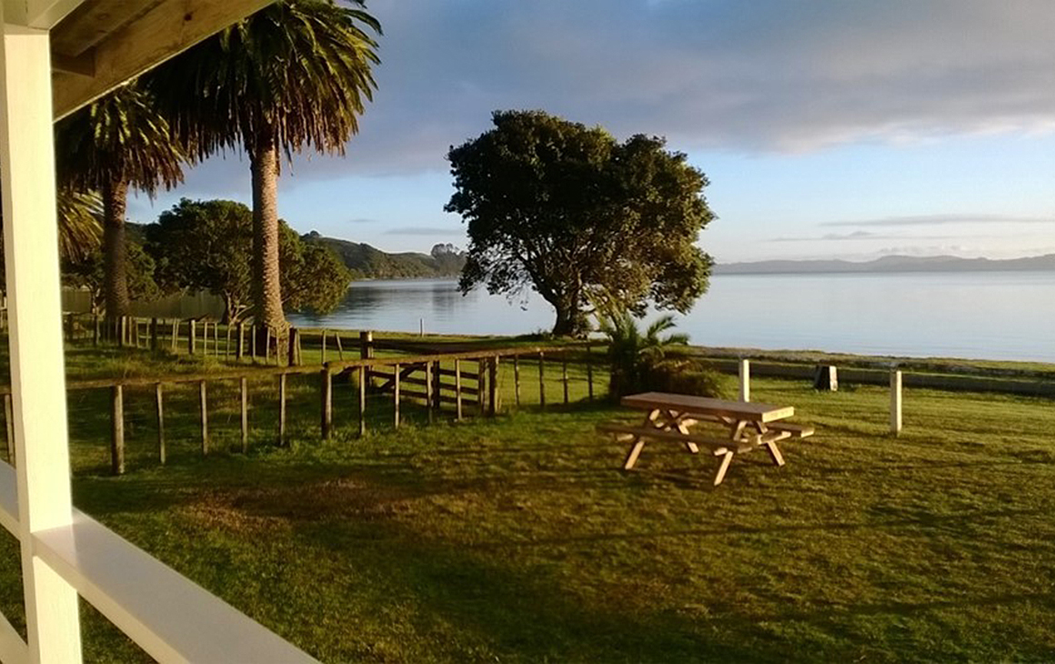 View from Te Kuiti House—Umupuia beach with view of foggy mountains afar.