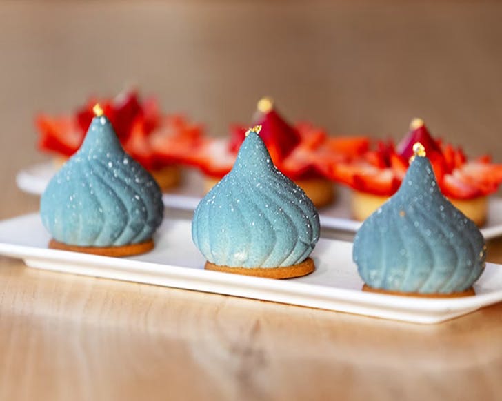 Three kiss-shaped cakes.