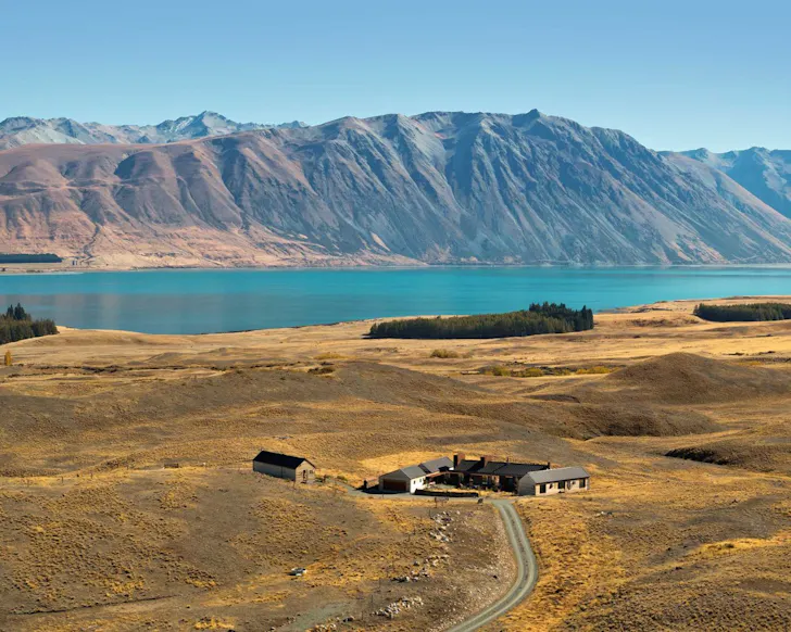An aerial view of Te Toka Villa with the lakefront and mountains in NZ