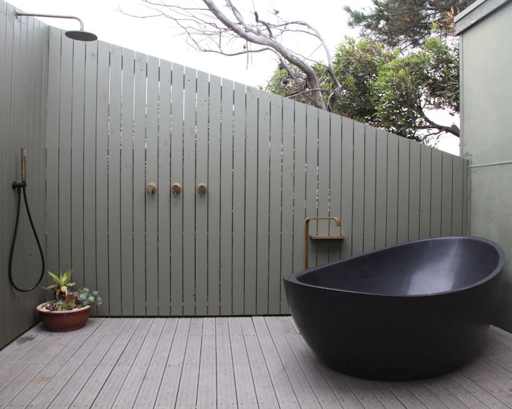 The outdoor bath at Tea Tree Hill one of the best beach house Airbnbs Victoria