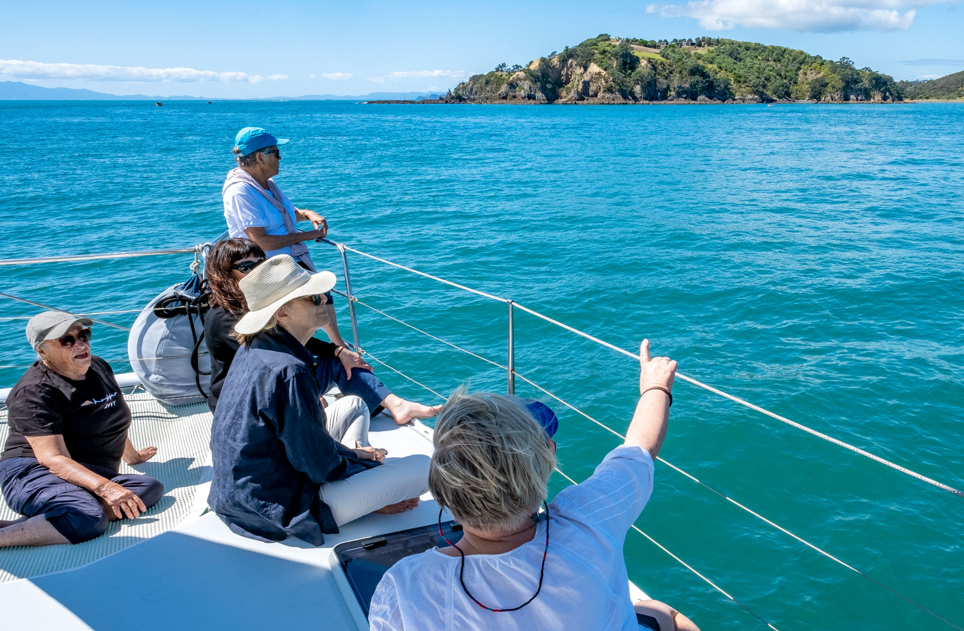 Group of friends on a yacht in the Hauraki Gulf with Terra and Tide