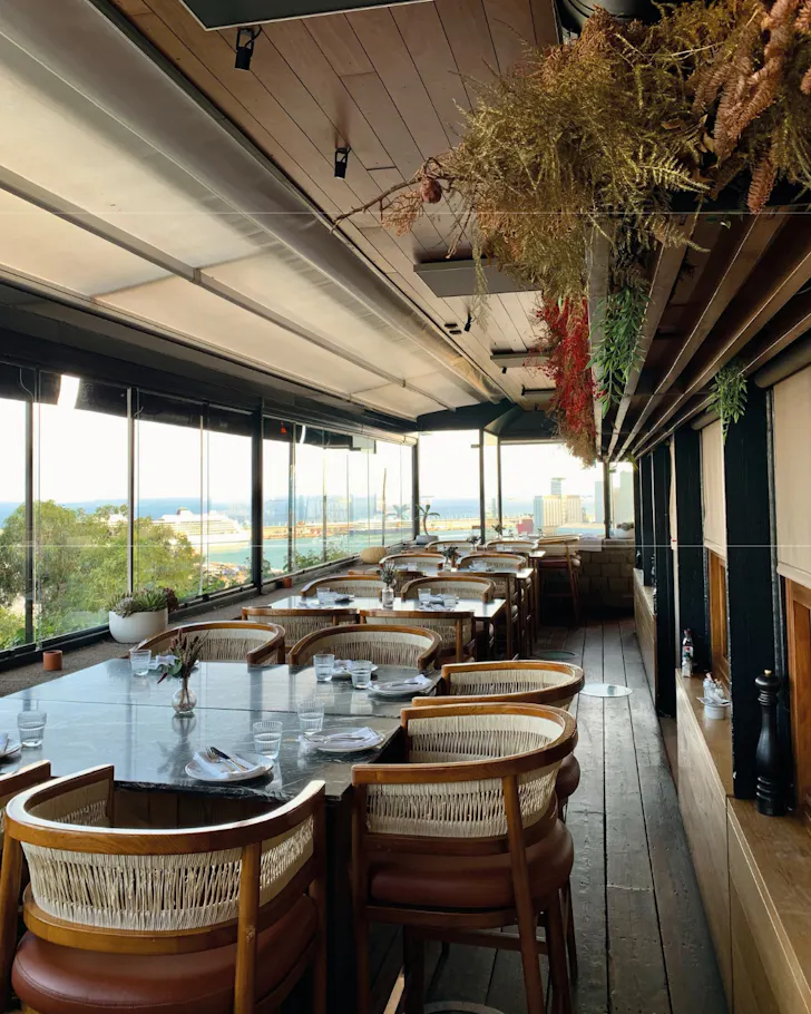 The sunlit terrace at Terraza Martinez in Barcelona. 