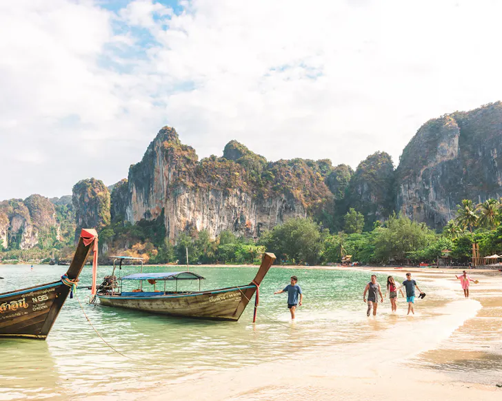 A boat on the shore of a beach in Thailand.