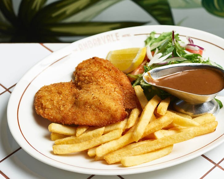 chicken schnitzel with chips and gravy boat