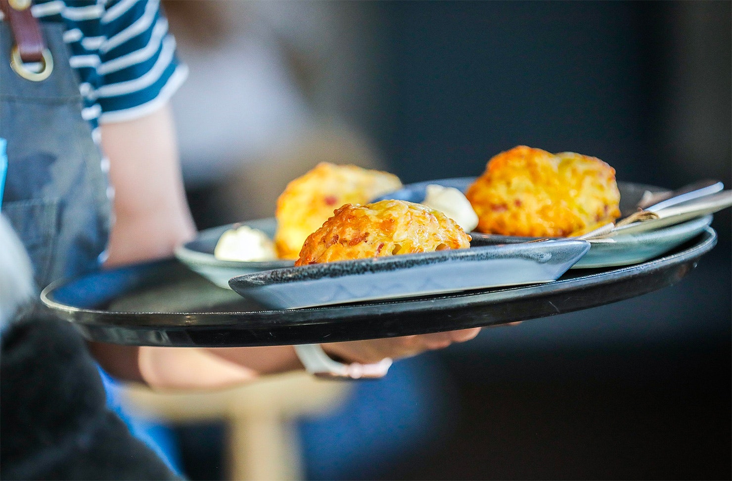 Someone brings scones to the table at the Batch Cafe in Invercargill.