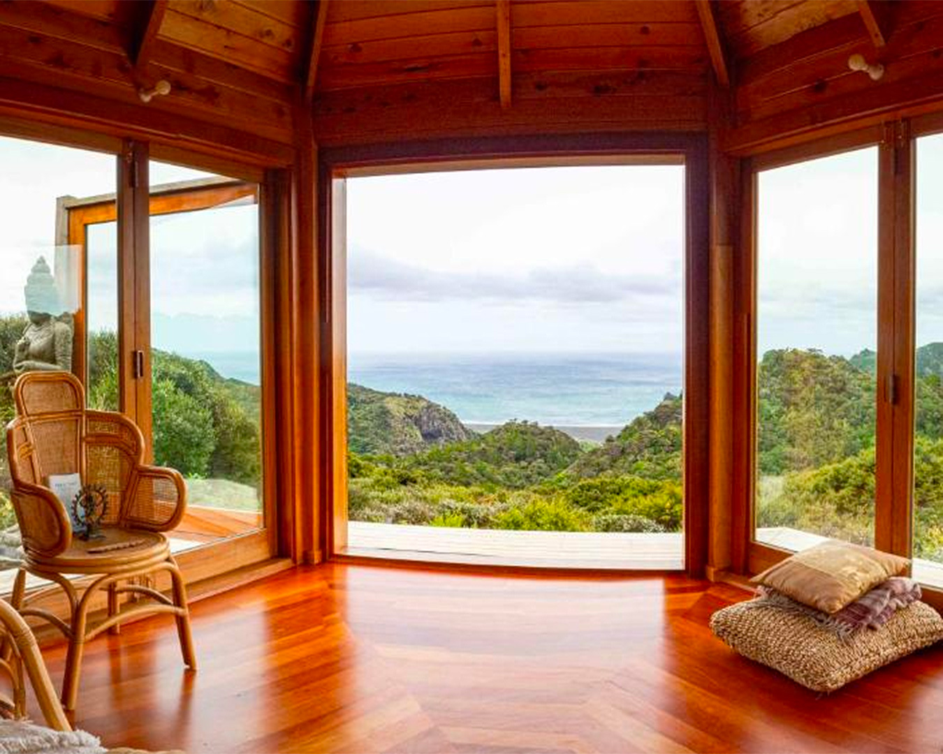 A wooden annex opens out to stunning ocean views at The Hermitage Solo Retreat. 