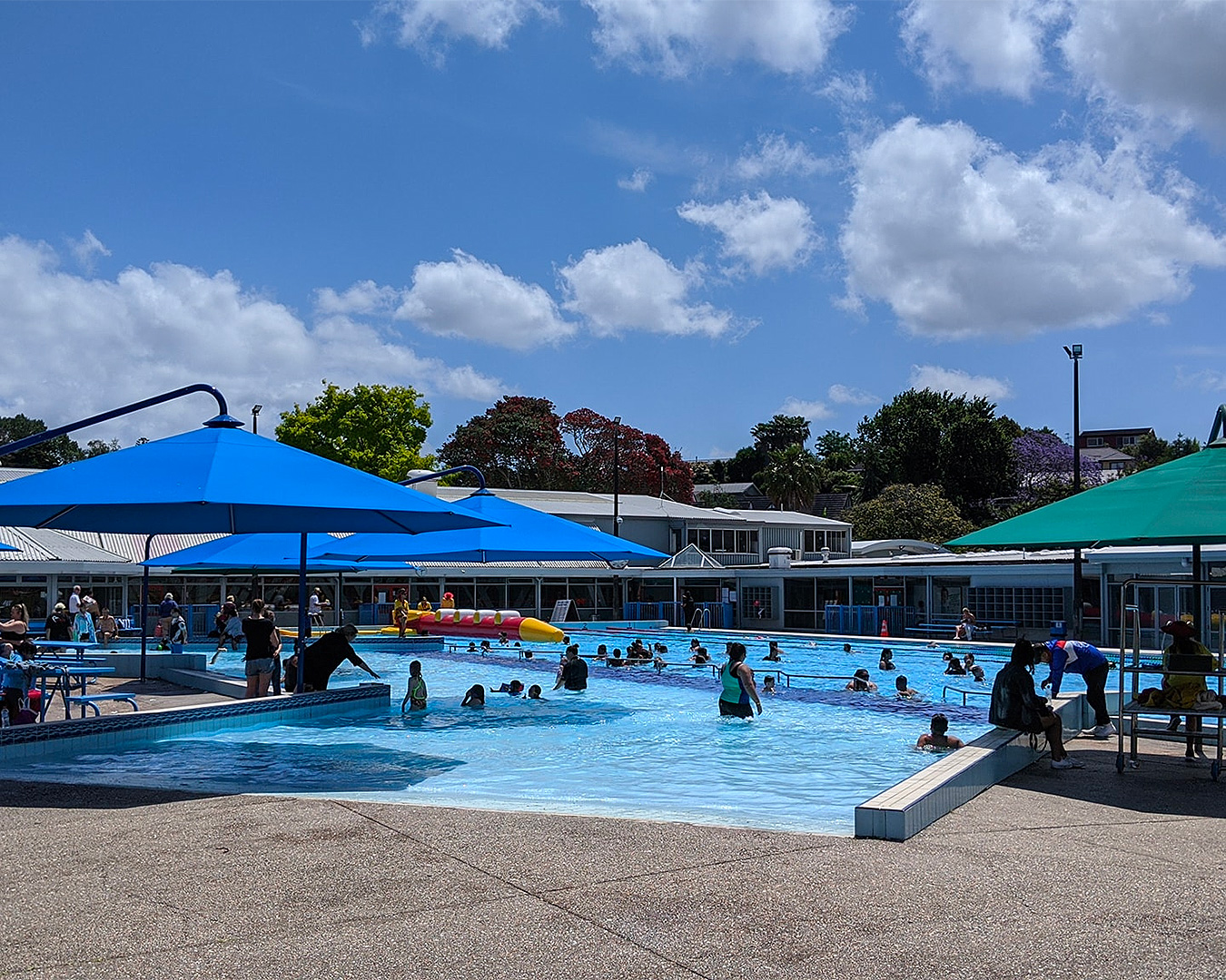 People splash about in the outdoor pool at The Y Lagoon Pool And Leisure Centre.