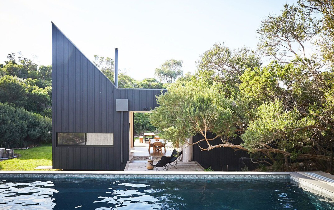 An angled house with a pool at one of the best Airbnbs in Victoria for 2023.