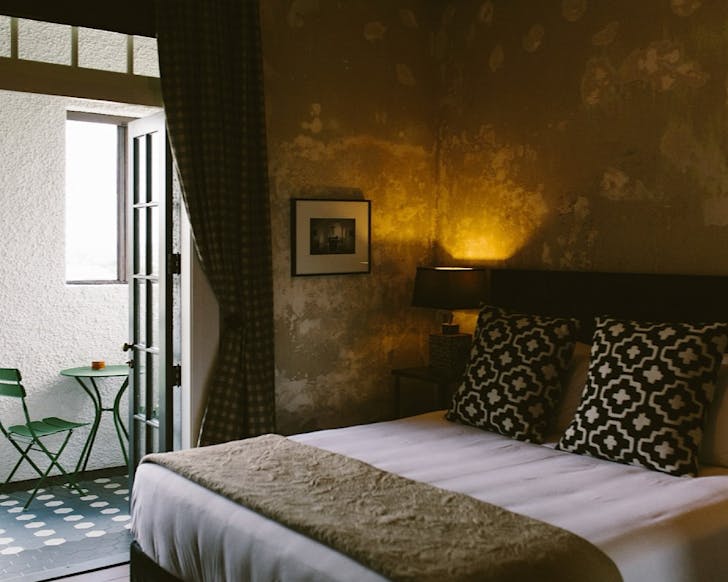 A Spanish mission-style hotel room.