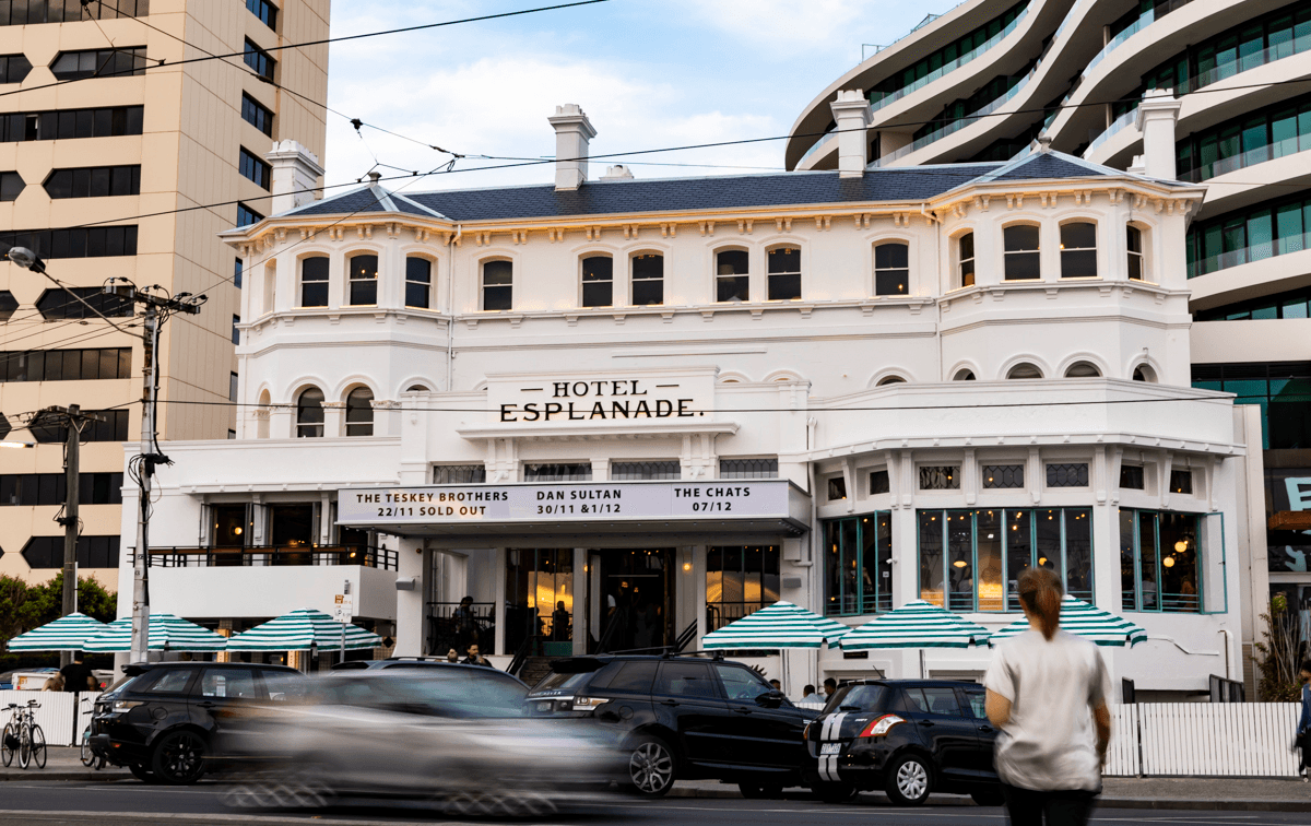 A large white building on a main street which is one of the best pubs melbourne