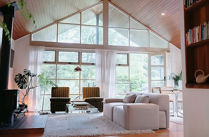 A view of the large window in the living space at The Hepburn Treehouse Airbnb one of the best accommodation options in Daylesford