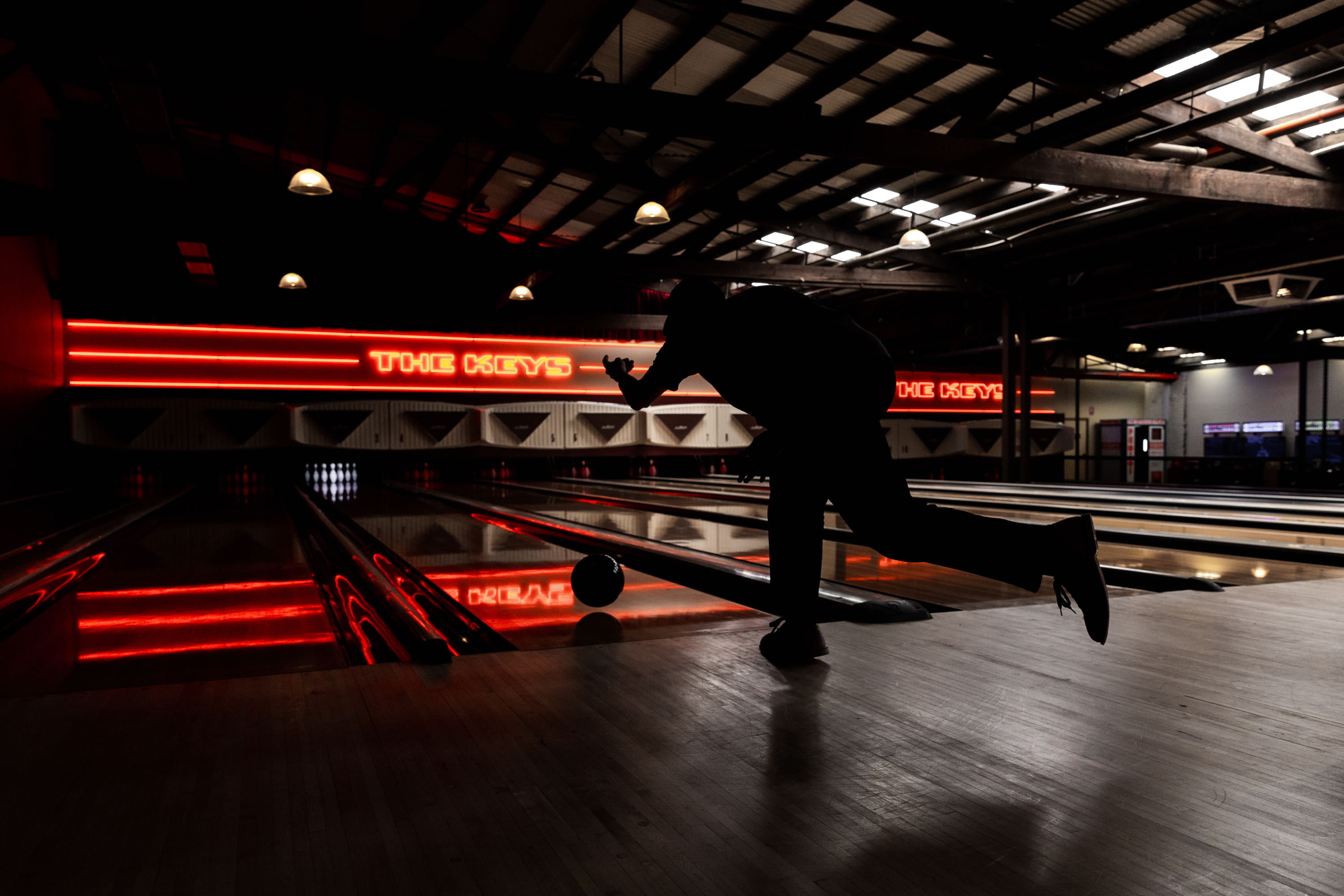  A person bowling at a lane of The Keys, one of the most fun things to do in Melbourne.
