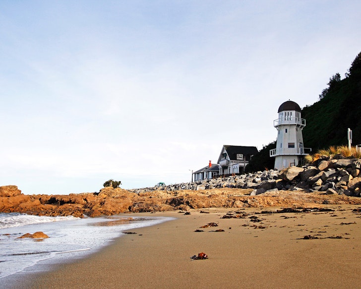 A view of The Lighthouse from the sand, one of the best Wellington Airbnbs