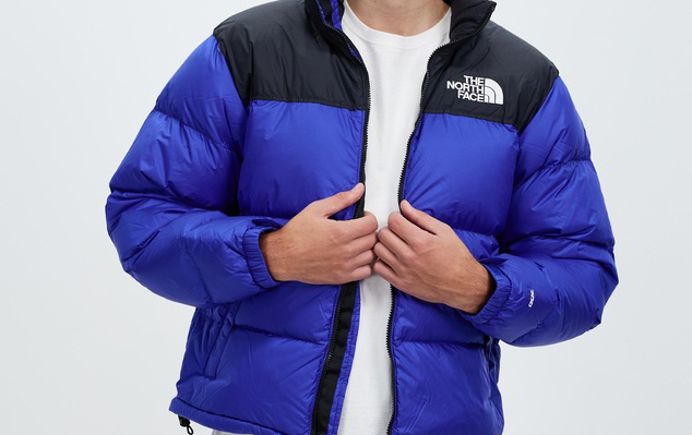 A lapis blue and black jacket, one of the best men's puffer jackets. 