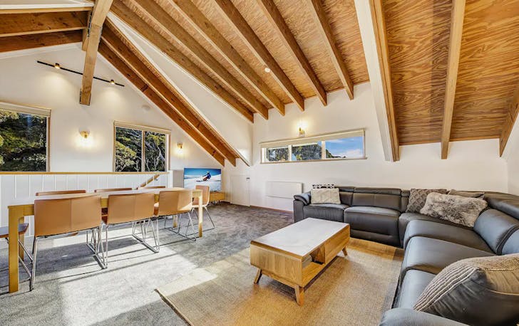 A large light-filled lounge room and dining, a best mt hotham accommodation.